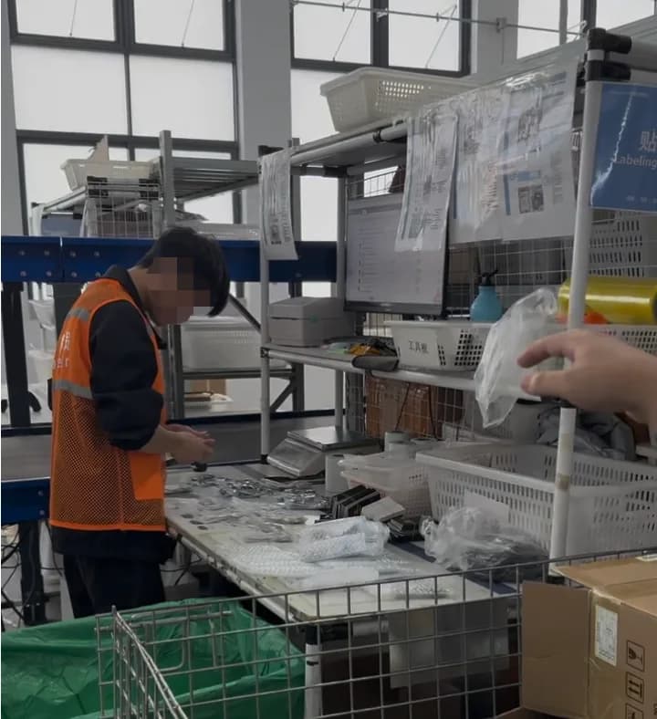 A worker checking products before packing and shipping